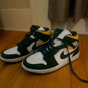 Green and yellow Nike Air Jordan’s
